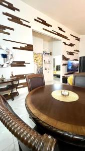 a dining room with a table and leather chairs at Coral Cove Oasis in Discovery Bay