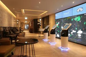 a hotel lobby with several cell phones on display at hub London - Spitalfields in London +20 photos