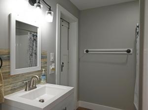 a white bathroom with a sink and a shower at Ottawa Family Nest in Ottawa +26 photos