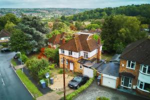 an aerial view of a house with a car parked in front at Contractor Base 4BR Fast WiFi Parking High Wycombe in Buckinghamshire