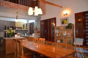 a large dining room with a wooden table and chairs at Kết nối home in Hai Phong