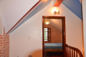 a stairway with a blue and white ceiling at Kết nối home in Hai Phong