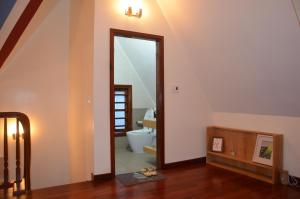 a room with a bathroom with a mirror and a toilet at Kết nối home in Hai Phong +22 photos
