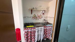 a kitchen with a sink and a stove at Arauca -Centro in Arauca