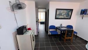 a room with a table and a small table and chairs at Arauca -Centro in Arauca