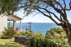 a house with a view of the ocean at Clifftop Coastal Sanctuary Panoramic Views in Mount Martha