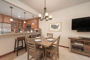 a kitchen and dining room with a table and chairs at Cozens Pointe Building G Unit 202 in Fraser