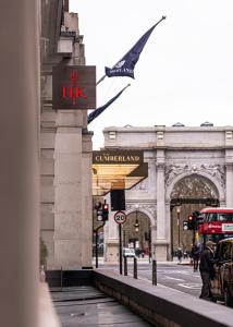 a building with a sign in front of a street at The Cumberland, London in London