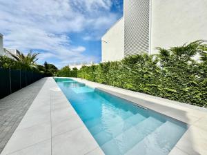 a swimming pool in front of a building at Villa 124 Residence in Lignano Sabbiadoro