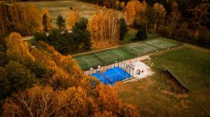 an aerial view of a tennis court with two tennis courts at Svencelė Resort in Svencelė