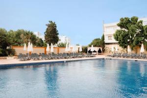 a large swimming pool with chairs and umbrellas at BLUESEA Salina Ex MD Atlantic in Es Cana +44 photos