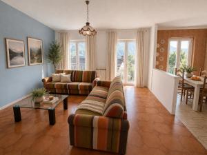 a living room with a couch and a table at Agata Agnese Homes in Carlazzo