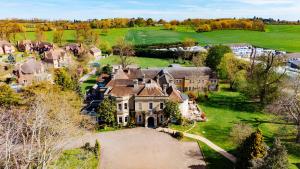 an aerial view of a mansion with a yard at Woodland Manor Hotel in Bedford