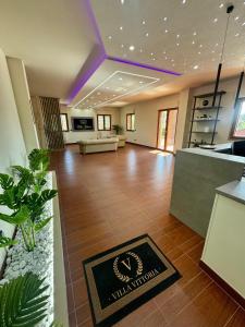 a large room with a lobby with a reception desk at Villa Vittoria Relais in Venosa