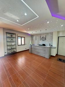 a large living room with a wooden floor at Villa Vittoria Relais in Venosa +32 photos