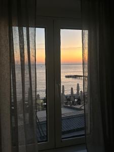a view of the ocean from a room with a window at Lili's Sea View in Budva