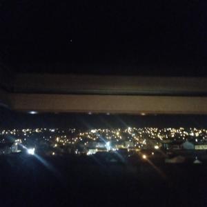 a view of a city at night with lights at Apartman Skyview in Požarevac
