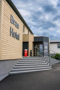 a building with a sign for a bike hotel at The Brae Hotel in Brae