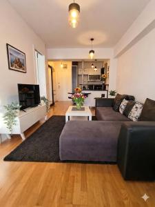 a living room with a couch and a table at Petar Apartment-City Center, Ohrid in Ohrid