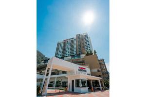 a large building with a store in front of it at Sunway Onsen Apartment Tambun by ELK Homestay in Tambun