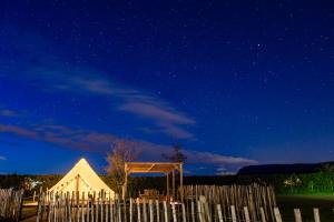 a white tent under a night sky with stars at Carrowmena School House & Glamping in Limavady