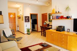 a living room with a couch and a dining room at La Collina D'Oro in Cernobbio