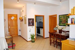 a kitchen and dining room with a table and a dining room at La Collina D'Oro in Cernobbio +17 photos