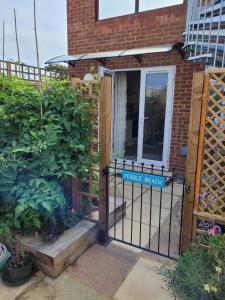 a gate with a sign that reads private beach at Pebble Beach, ground floor 1 bedroom flat in Chichester