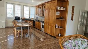 a kitchen with a table and a dining room at Hradna 9a in Nové Zámky