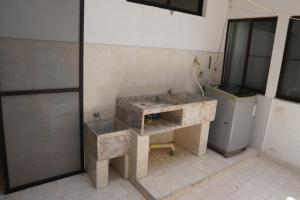 a dirty bathroom with a sink and a toilet at Casa Esperanza in Cali +34 photos