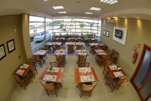 A restaurant or other place to eat at Caleche Park Hotel