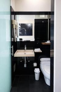 a bathroom with a sink and a toilet at PlazaMar Pacifico Hotel in Buenaventura +44 photos