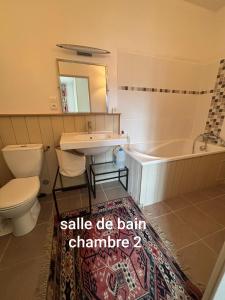 a bathroom with a sink and a tub and a toilet at Maison Suzanne, Downtown, 6 Guests in Cancale +23 photos
