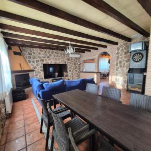a living room with a wooden table and chairs at Finca Don Sancho by Mayne in Lillo