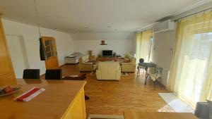 a living room with a couch and a table at Podlugovi House Villa in Podlugovi