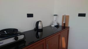 a kitchen with a counter top with a blender on it at Era 25 in Ahangama