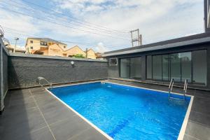 a swimming pool on the side of a building at Mex 1 bedrooms Lekki phase1 in Lagos