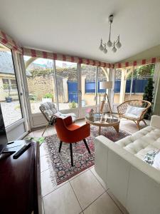 a living room with a couch and a table at Maison Suzanne, Downtown, 6 Guests in Cancale
