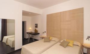 Giường trong phòng chung tại Relais Villa D'Assio