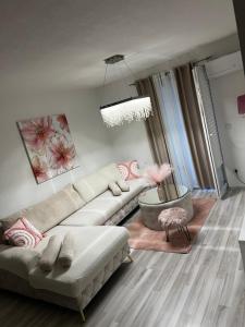 a living room with a couch and a chair at ApartmanJ&K in Kiseljak