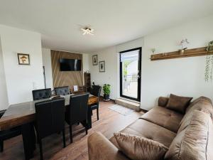 a living room with a couch and a table at Haus-Elena-Wohnung-7C in Bestwig