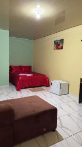 a bedroom with two beds in a room at Hotel e Residencial Solar in Uruara