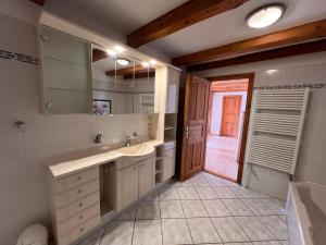 a bathroom with a sink and a mirror at Pension Schmelzer in Kägsdorf +116 photos