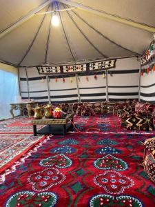 a room with a large rug on a tent at شقه مفروشه in Hail
