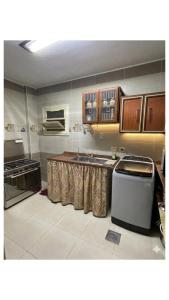 a kitchen with a sink and a counter top at Private Bella Rum Villa with Garden in Marsa Matruh