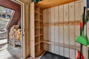 a sauna with wooden walls and a door at Windham Mountain Condo with Deck & Stunning Views in Windham