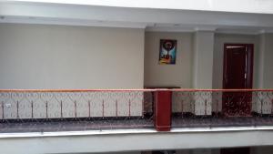 a balcony of a building with a red railing at FT Hotel in Addis Ababa