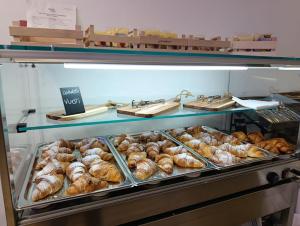 a display case in a bakery with lots of pastries at Hotel Pace in Pompei