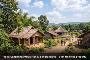 a group of people walking around a village at Collection O MP Nagar in Bhopal