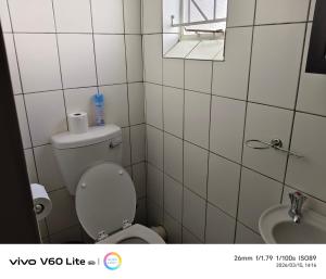 a small bathroom with a toilet and a sink at Firehouse self-catering unit 6 in Wellington